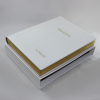 White leather guest book with gilt block and embossing